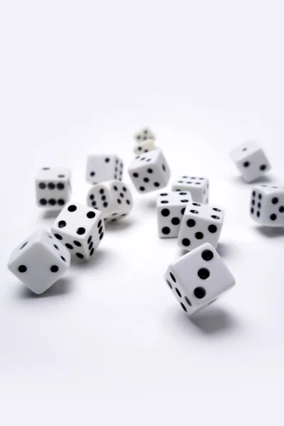 Lots of dice tumbling on white background — Stock Photo, Image