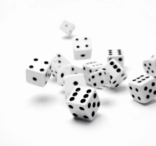 White dice rolling on white background — Stock Photo, Image
