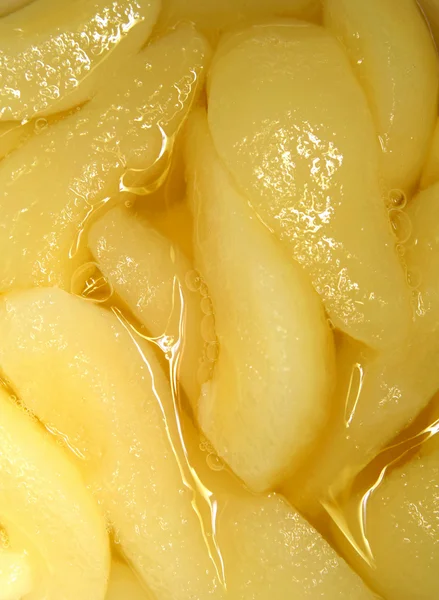 Closeup of pear slices in juice — Stock Photo, Image