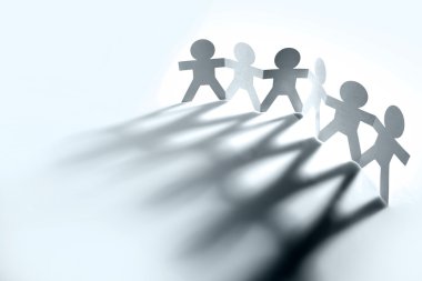 Group of holding hands casting shadows clipart