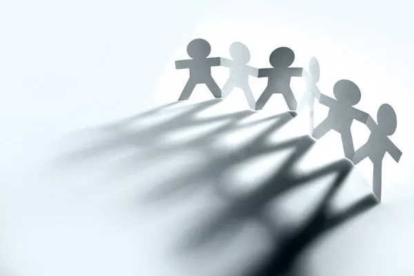 Group of holding hands casting shadows — Stock Photo, Image