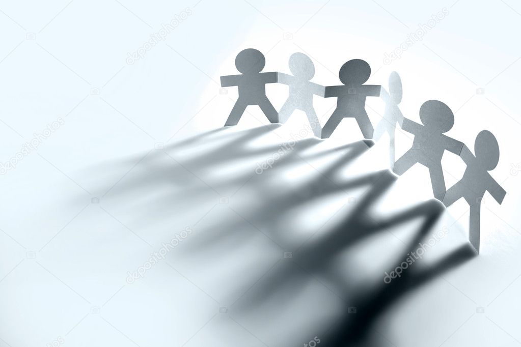 Group of holding hands casting shadows