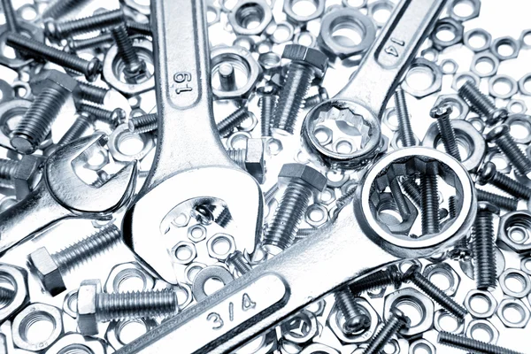 Closeup of spanners on nuts and bolts — Stock Photo, Image