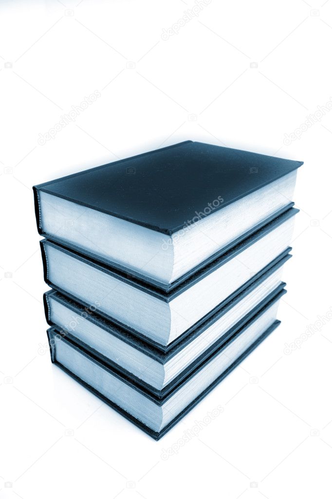 Stack of four books on white
