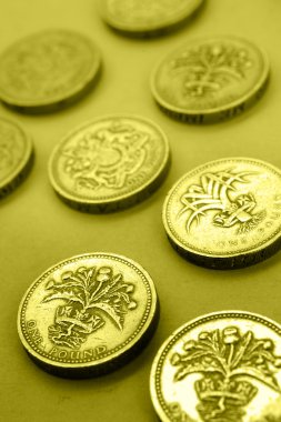 Closeup of British one pound coins clipart