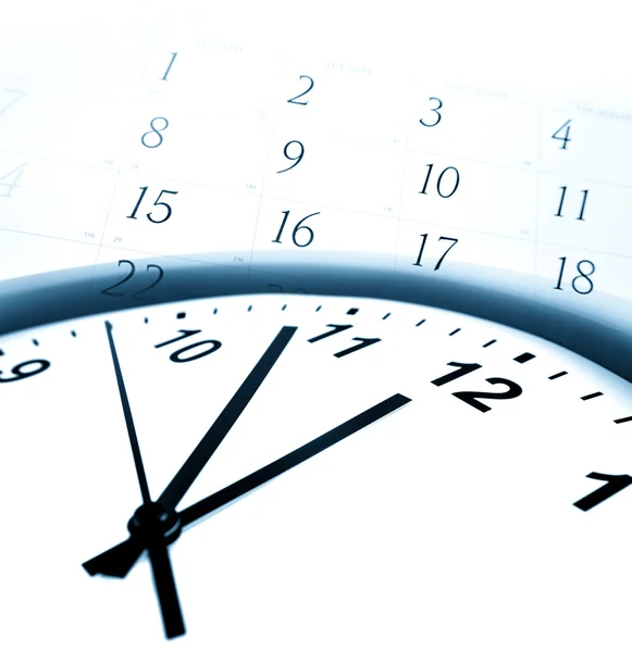 Closeup of clock face and calendar numbers — Stock Photo, Image