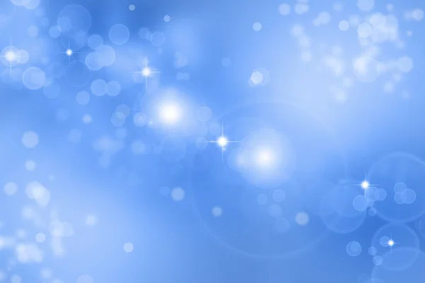 Estrelas cintilantes em um fundo azul — Fotografia de Stock