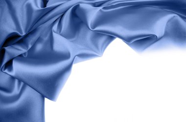 Blue silk material on white background. Copy space clipart