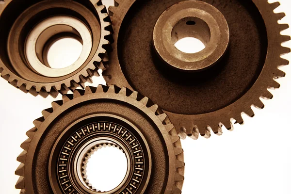 Closeup of three steel cogs together — Stock Photo, Image