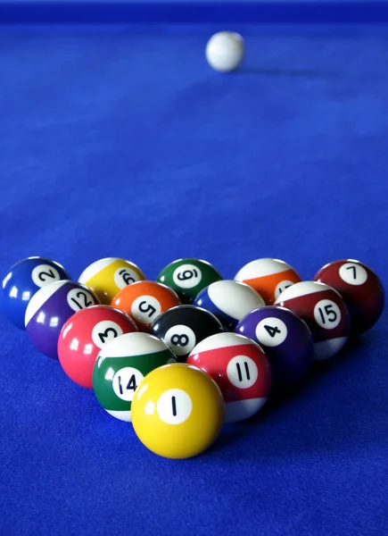 Pool balls on blue pool table — Stock Photo, Image