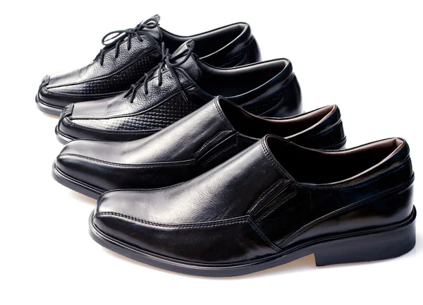 Black geniune leather businessmen 's shoes on white — стоковое фото