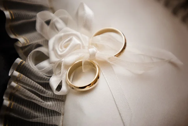 stock image Wedding rings on lace