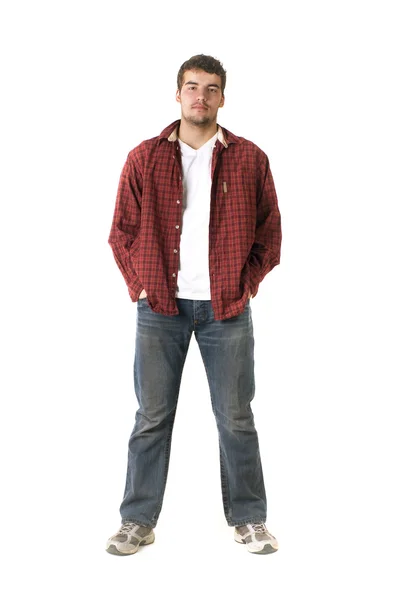 Портрет стильного молодого человека, стоящего с руками в карманах — стоковое фото