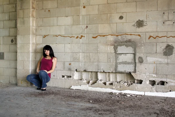 stock image Beautiful Brunette at a Block Wall (5)