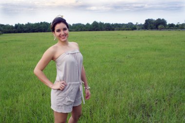 Beautiful Brunette in a Grassy Field (1) clipart