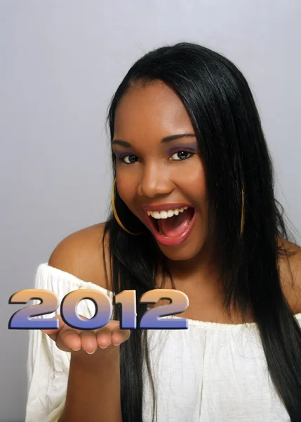 Beautiful Haitian Girl Holds "2012" in her hands — Stock Photo, Image