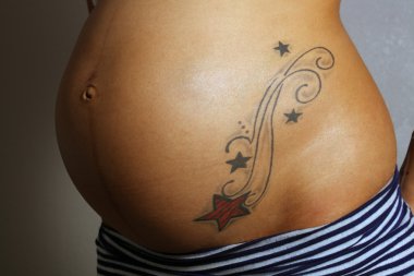 Pregnant Female Belly with Tattoo (1) clipart