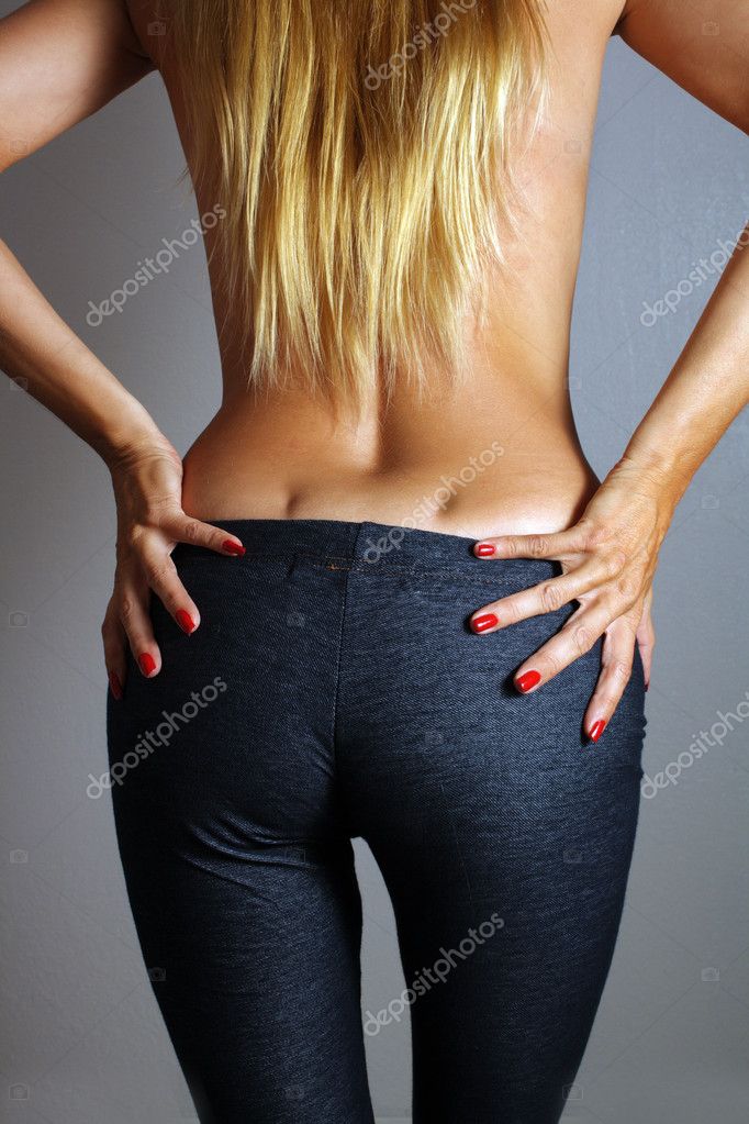 Female ass on black background. Sexual female big buttocks. Woman backside.  Perfect ass. Stock Photo