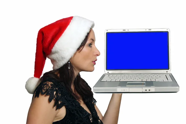 Krásná brunetka s santa klobouk a laptop — Stock fotografie