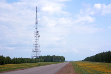 The road passes by cellular antennas clipart