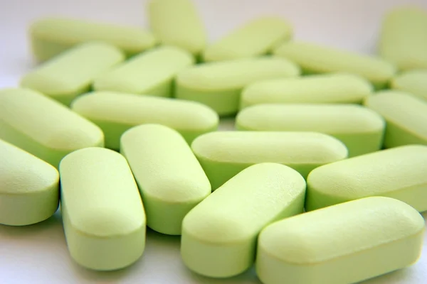 Mnoho zelené pilulky — Stock fotografie