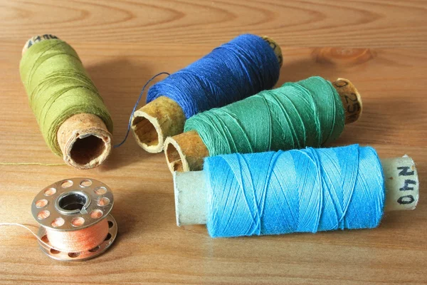 Colorful spools of thread close up on the table