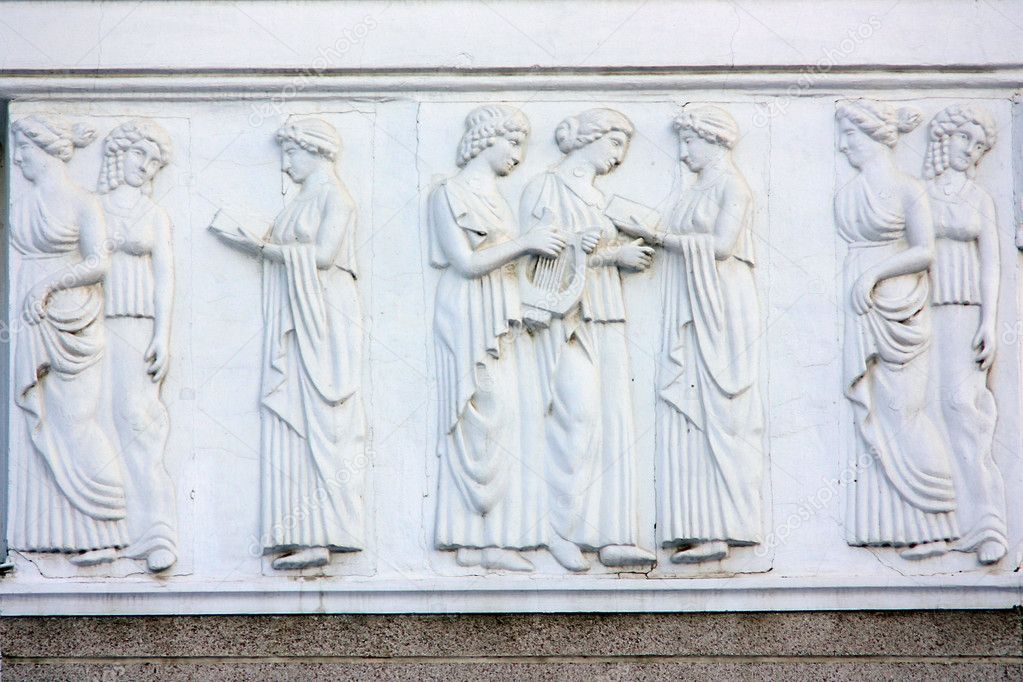 A fragment of the facade of the building with a bas-relief in the Greek style