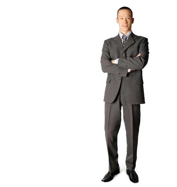 Sonriente hombre de negocios de pie en traje Fotos De Stock