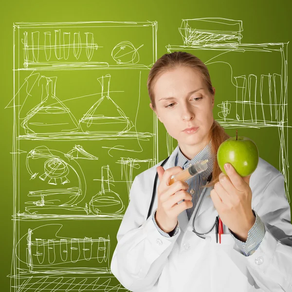 Científica mujer con manzana —  Fotos de Stock