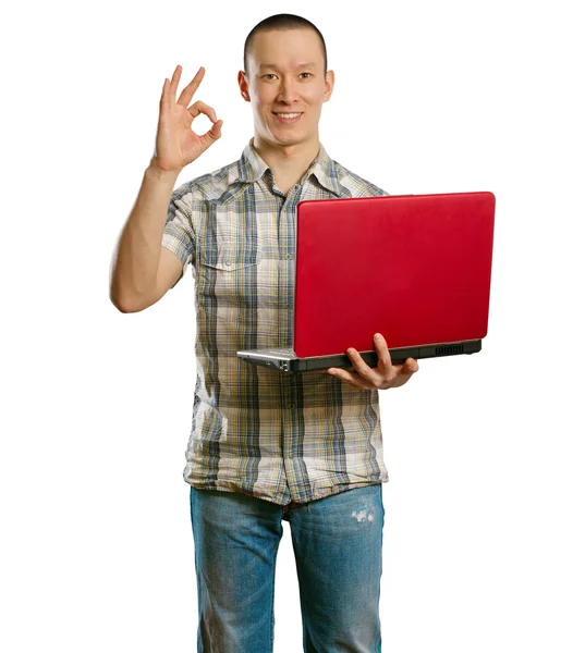 Asiático macho con portátil en sus manos muestra OK —  Fotos de Stock