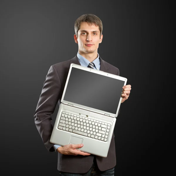 Affärsman med öppna laptop i hans händer — Stockfoto
