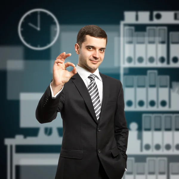 Happy businessman in suit shows OK — Stock Photo, Image