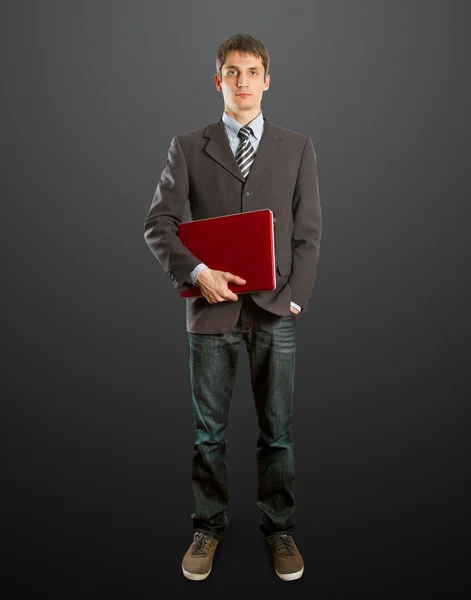Masculino de terno com laptop em suas mãos — Fotografia de Stock