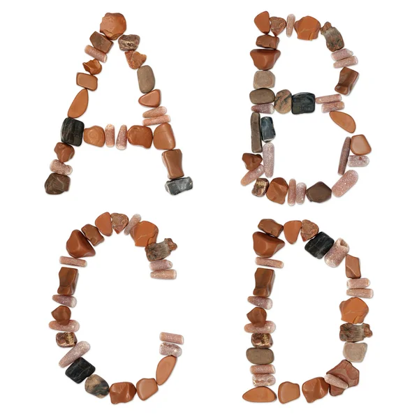 Alphabet aus Ozeansteinen in Nahaufnahme — Stockfoto