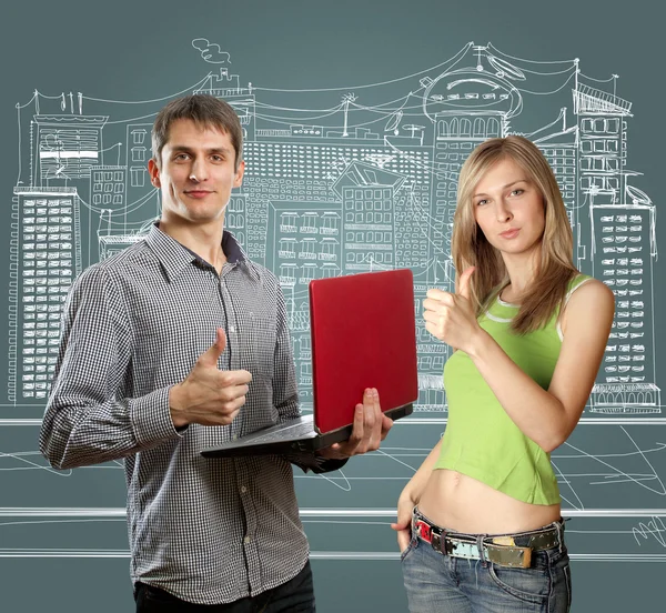 Man met laptop in zijn handen en vrouw — Stockfoto