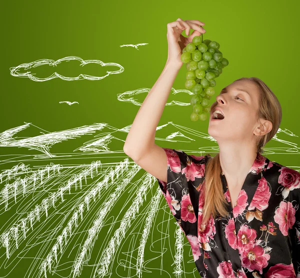 Woman with grapes — Stock Photo, Image
