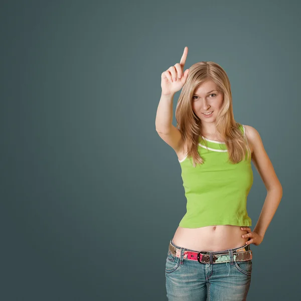 Junge Frau mit erhobenem Zeigefinger — Stockfoto