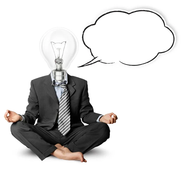 Lamp-head businessman in lotus pose with speech bubble — Stock Photo, Image