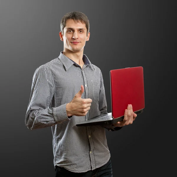 Laptop Aferin onun elinde olan bir erkek — Stok fotoğraf