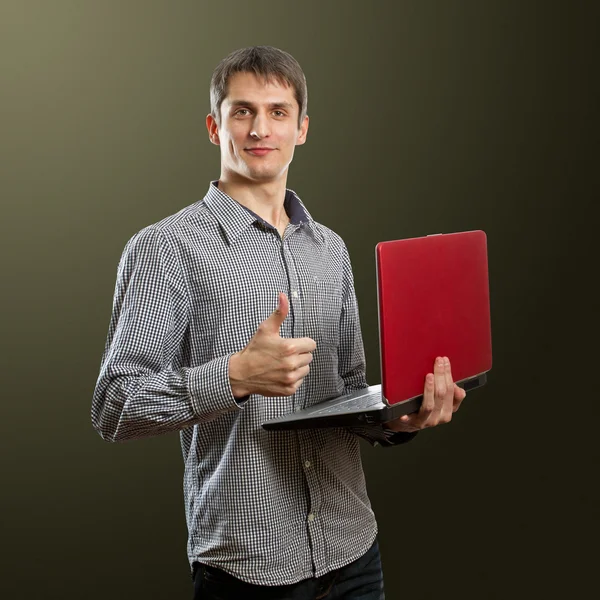 Maschio con computer portatile in mano ben fatto — Foto Stock