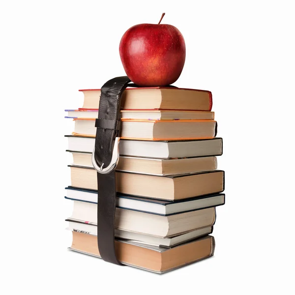 Boeken stapel met riem en apple — Stockfoto