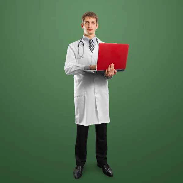 Doctor hombre de traje con portátil en sus manos — Foto de Stock