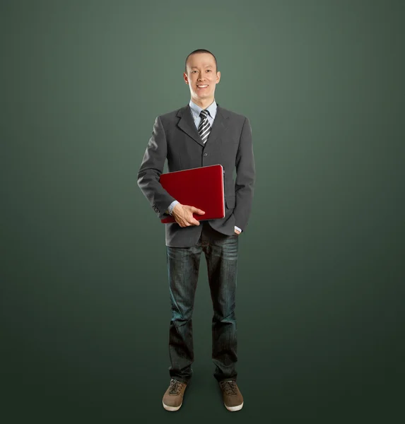 Män i kostym med laptop i hans händer — Stockfoto
