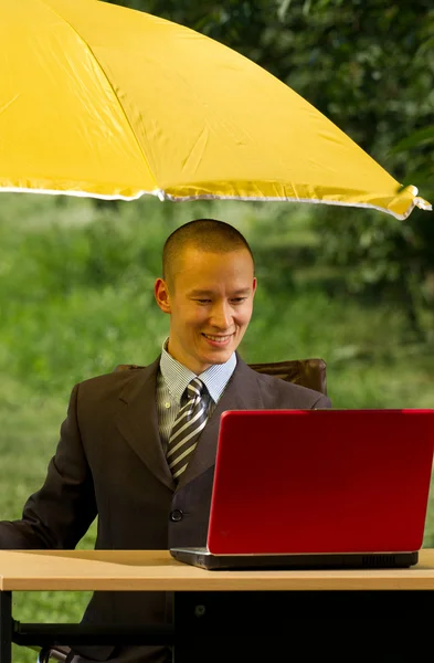 Businessman with umbrella — Stock Photo, Image