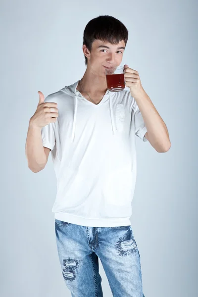 Teenager with a cup of tea — Stock Photo, Image