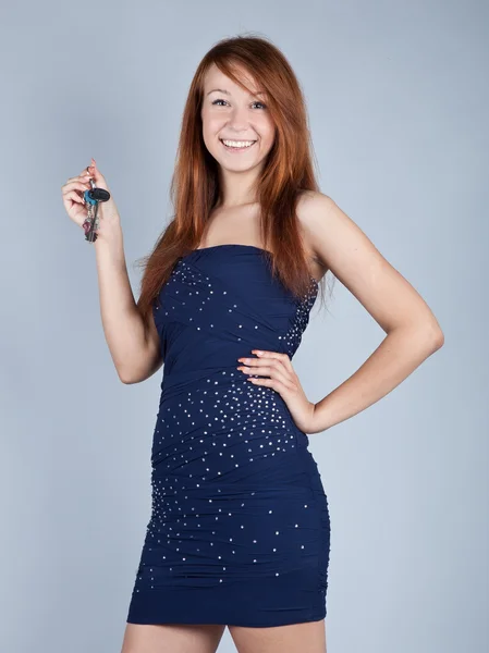 Cute young woman in navy blue dress — Stock Photo, Image