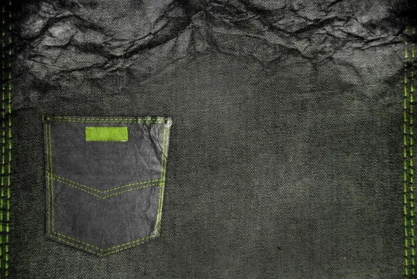 Geplette jean met een zak en groene stitch — Stockfoto