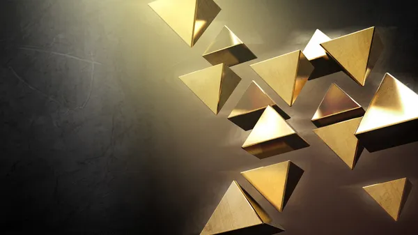 Золотые 3D пирамиды — стоковое фото