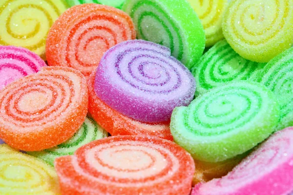 Kolorowe cukierki na tle. — Zdjęcie stockowe