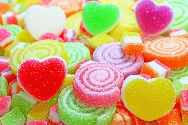 Kleurrijke suikergoed op een achtergrond. — Stockfoto